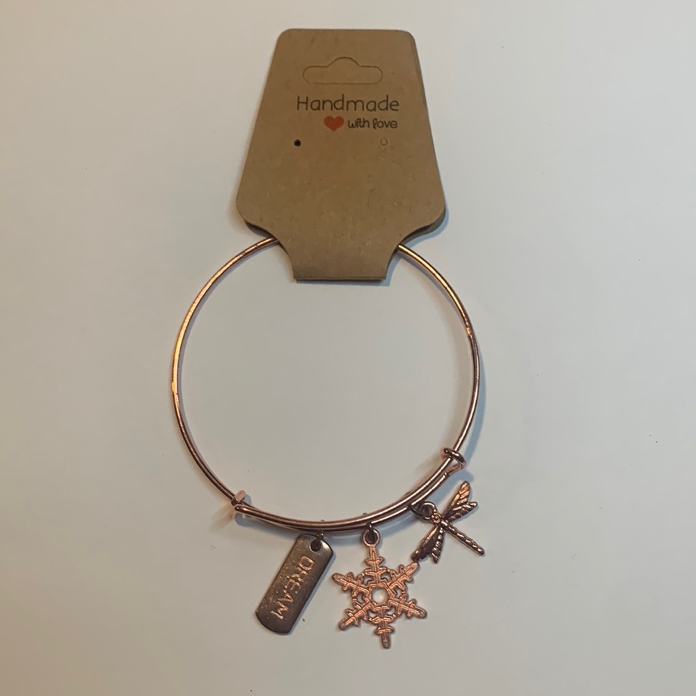 Handmade rose gold stainless steel bracelet with 3 charms.